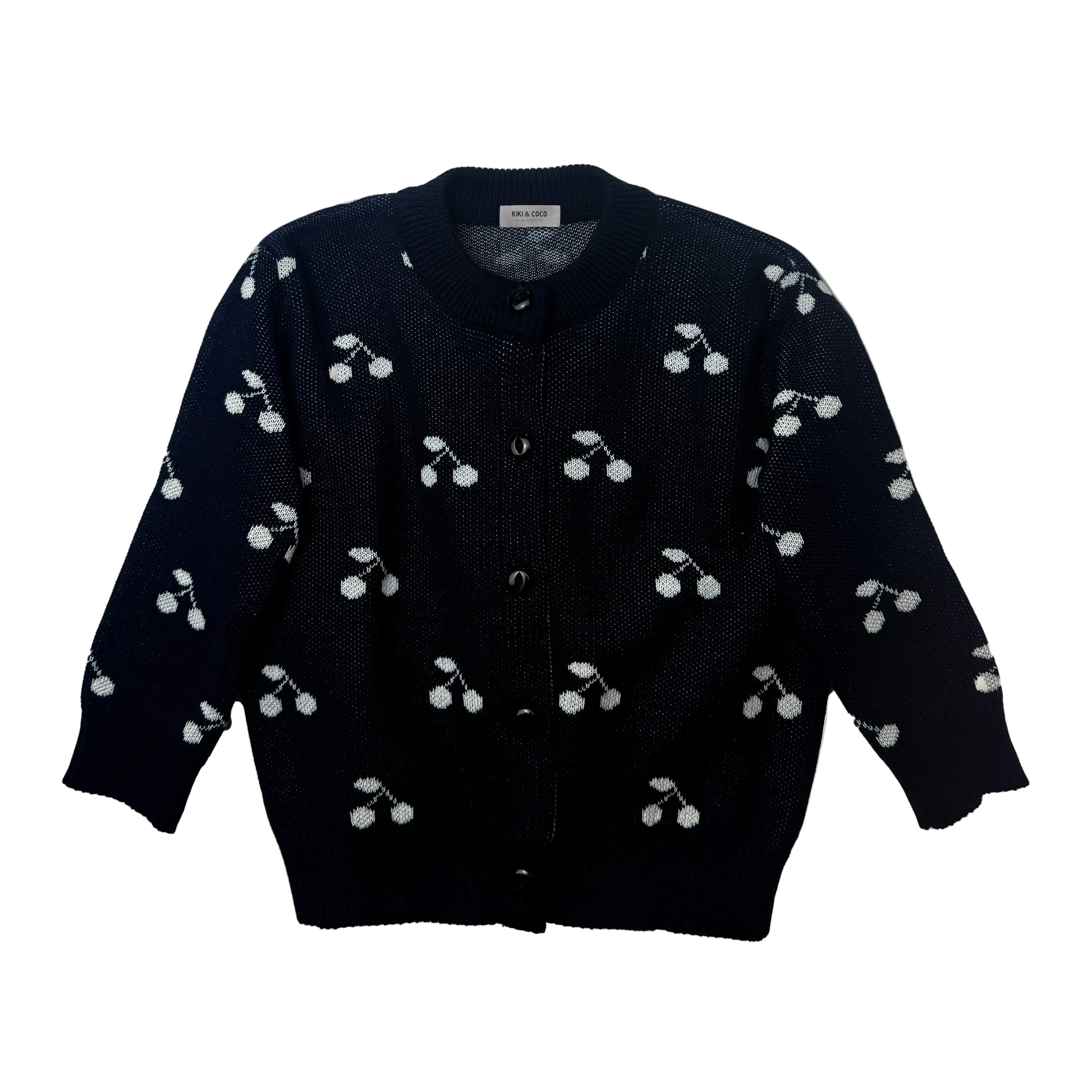 Chompa tejida cerezas blancas