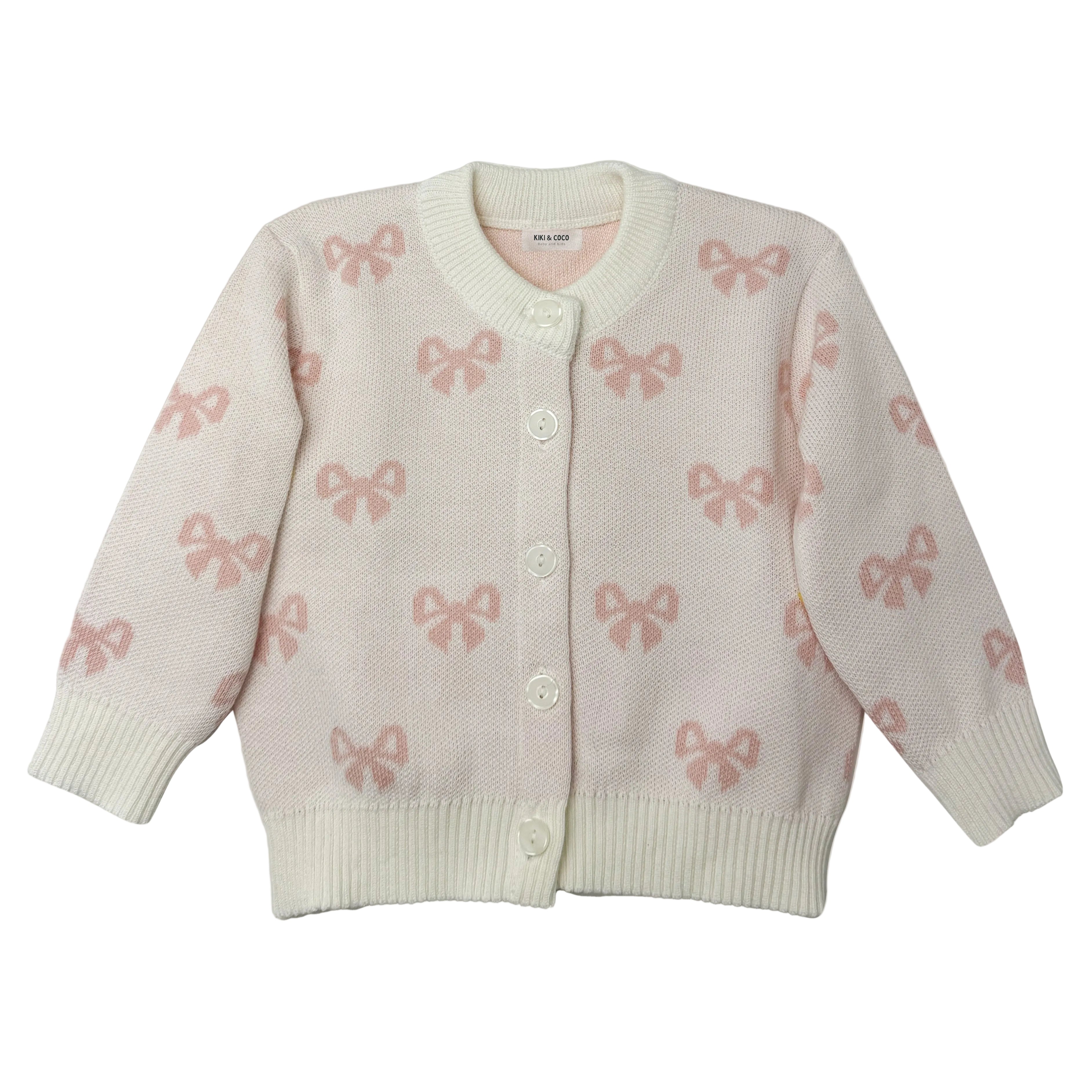 Chompa tejida lazos rosados